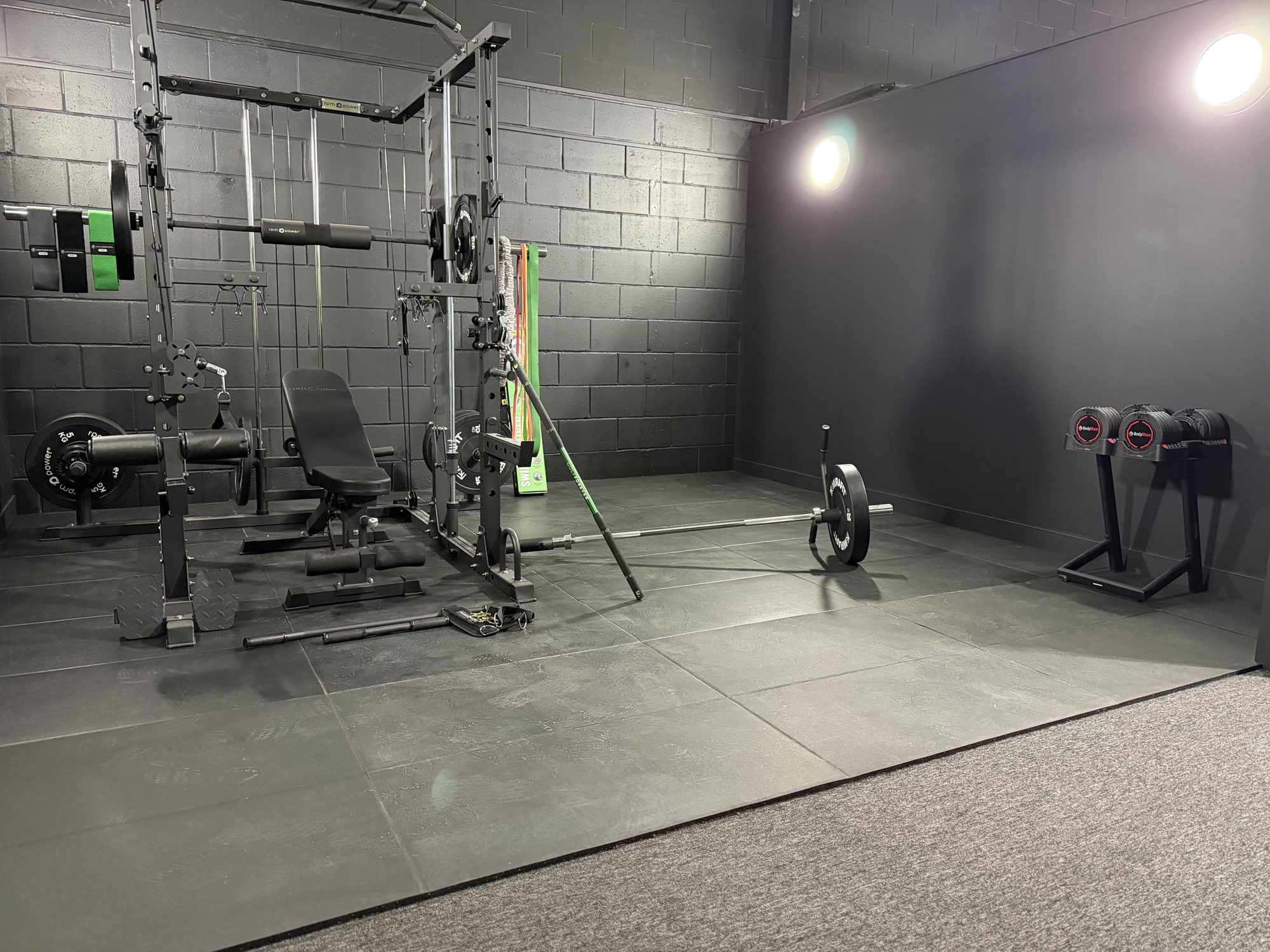 PGP gym with power rack, bench, barbell and adjustable dumbbells